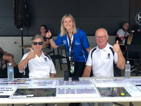 volunteers with their thumbs up